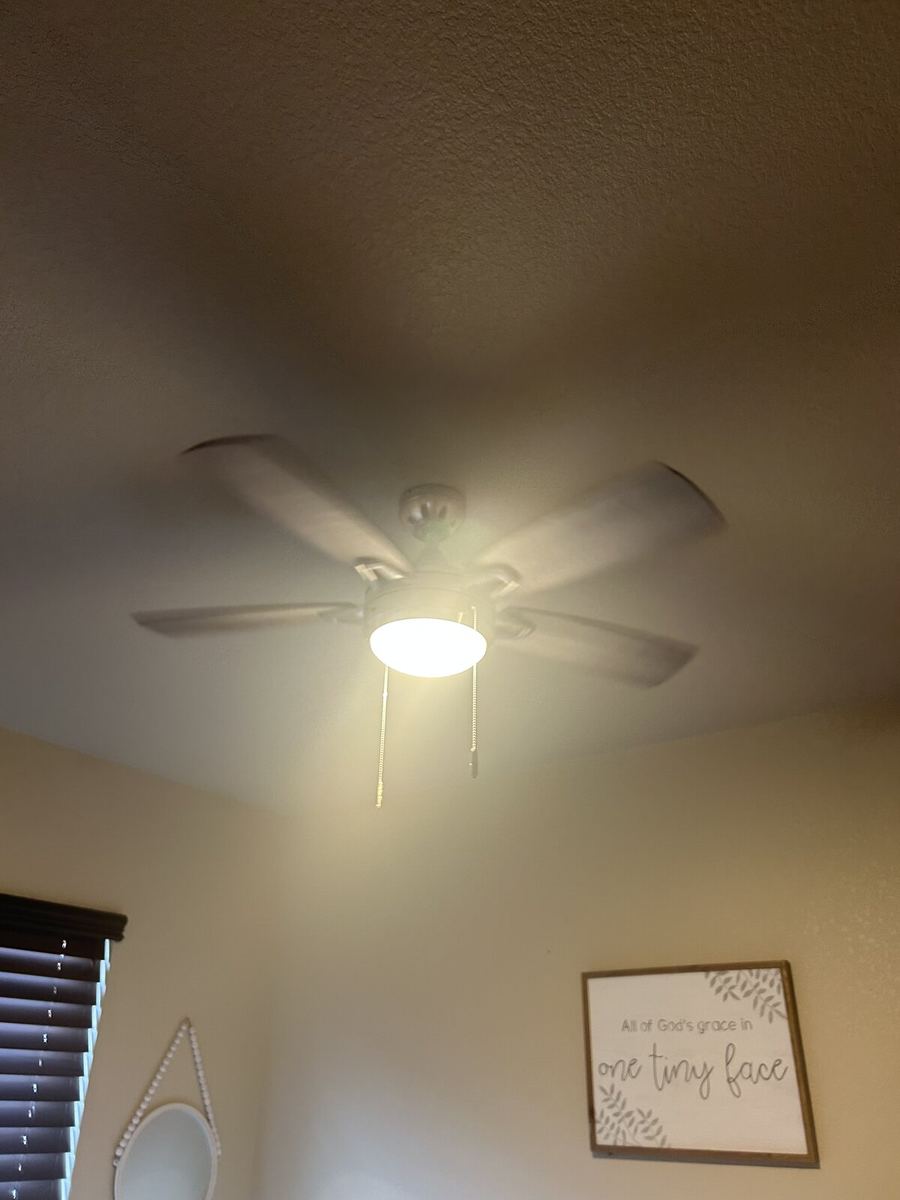 Slim-profile modern ceiling fan installed on a vaulted ceiling