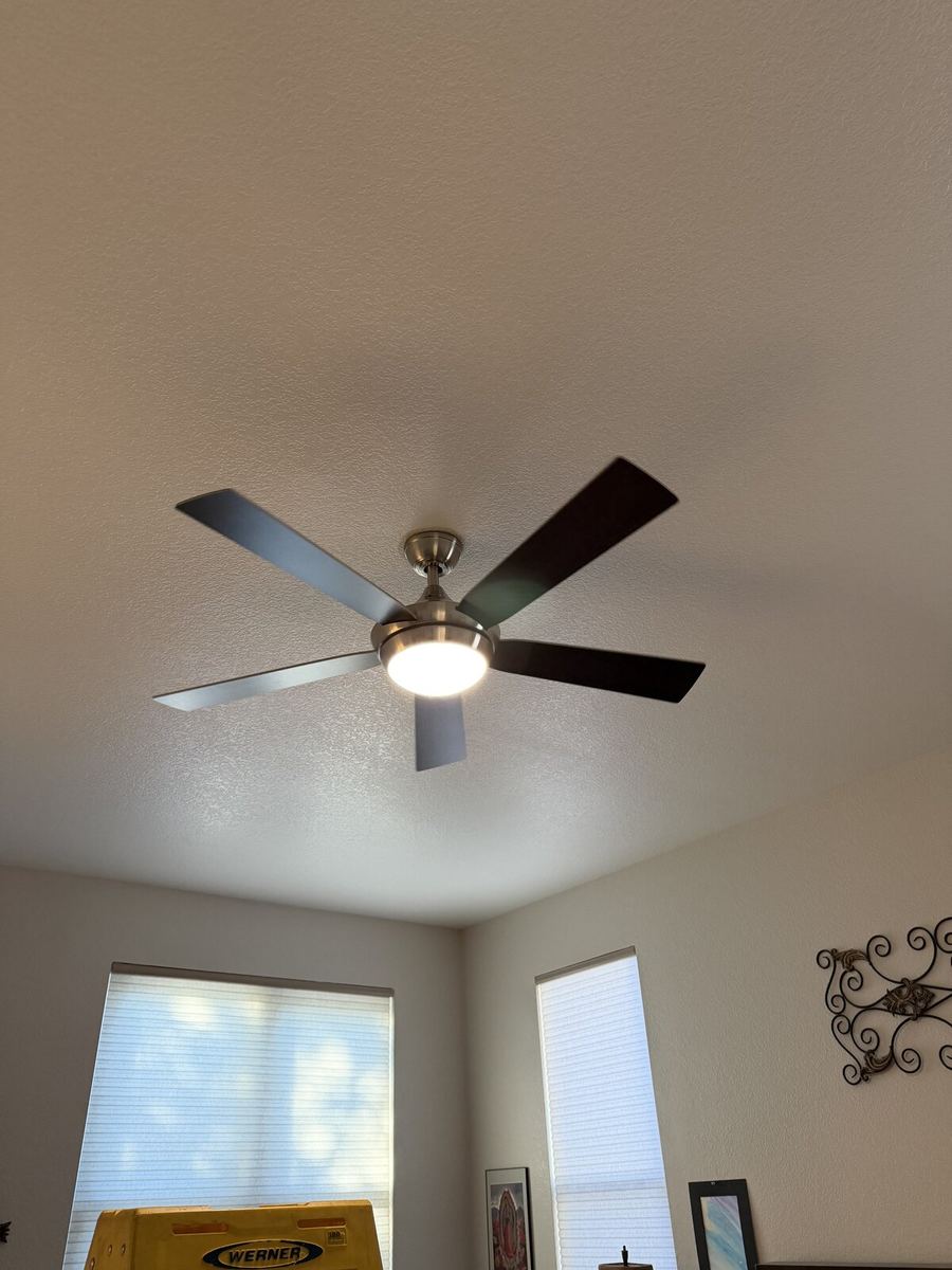Modern ceiling fan installed in a bedroom