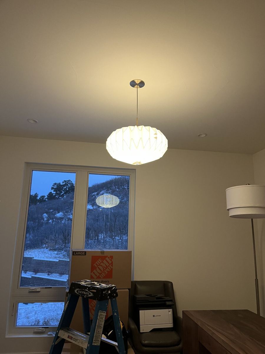 Modern halo flush-mount ceiling light in a residential hallway