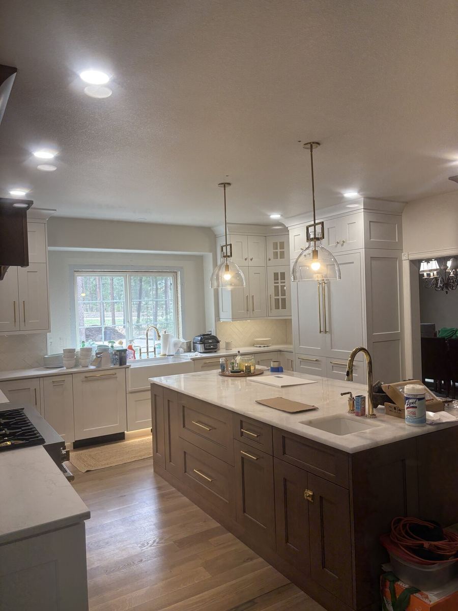 Glass pendant lights over kitchen island