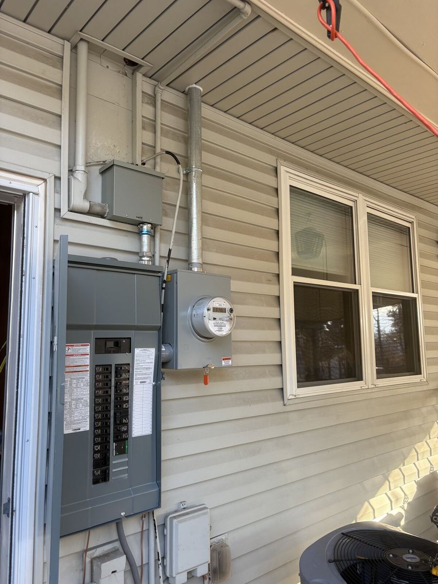 Panel upgrade in process — new conduit run during main feed rework