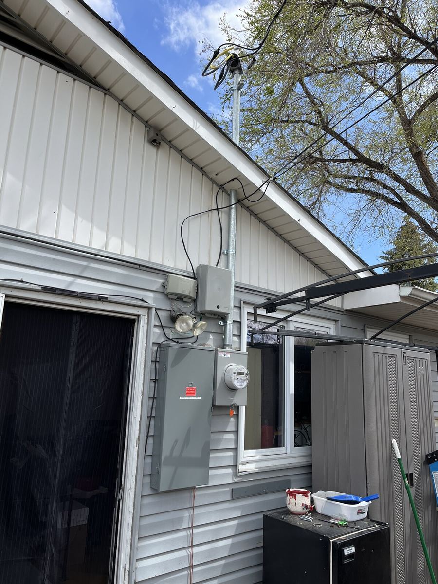 Open service disconnect during install with exposed feeder cables and breakers