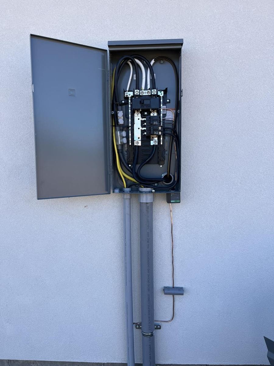 Exterior panel with new disconnect and meter on aluminum siding alternate angle